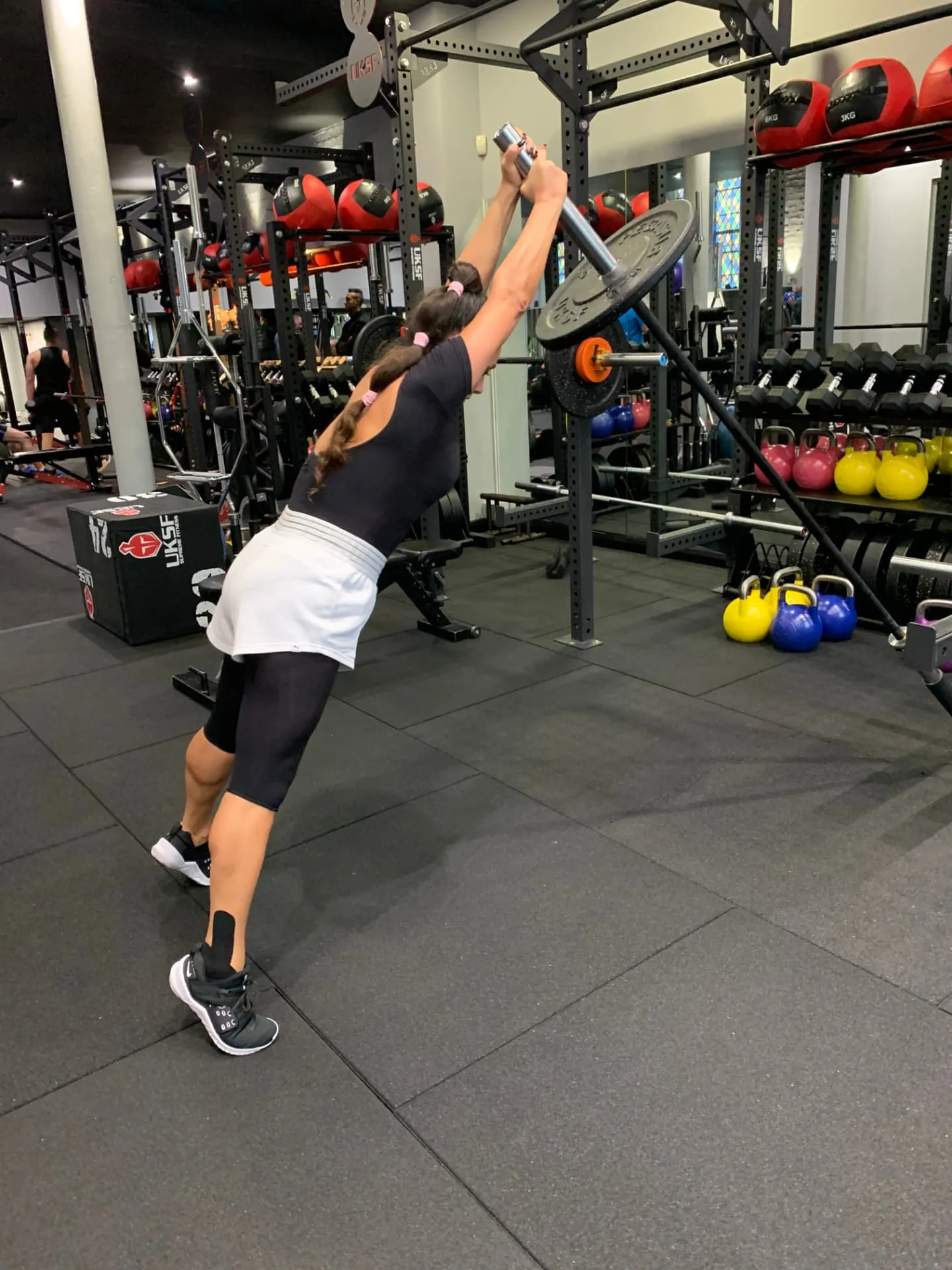 Lewis Paris coaching a personal training client in central London