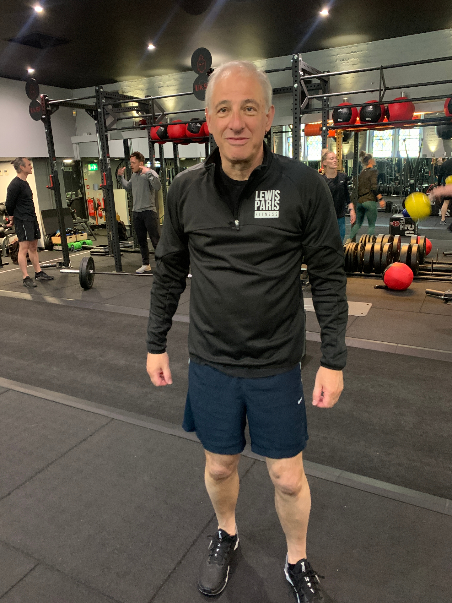 Lewis Paris Fitness client standing in the gym
